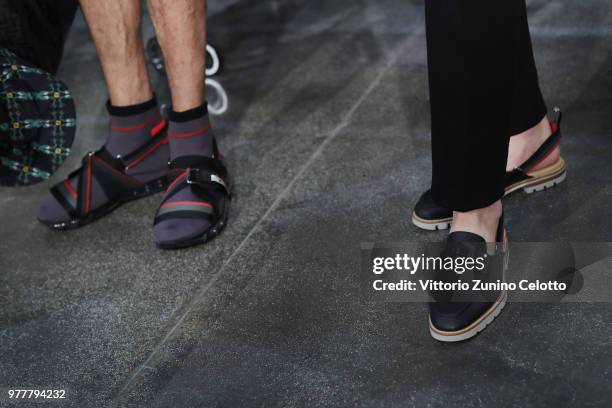 Models, shoe details, are seen backstage ahead of the Fendi show during Milan Men's Fashion Week Spring/Summer 2019 on June 18, 2018 in Milan, Italy.