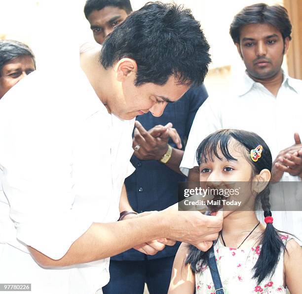 Bollywood actor Aamir Khan celebrates his Birthday with media in Mumbai on March 14, 2010.