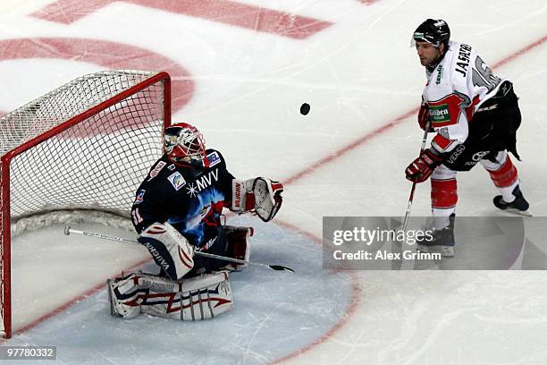 Goalkeeper Fred Brathwaite of Mannheim makes a save against Jason Jaspers of Koeln during the DEL match between Adler Mannheim and Koelner Haie at...