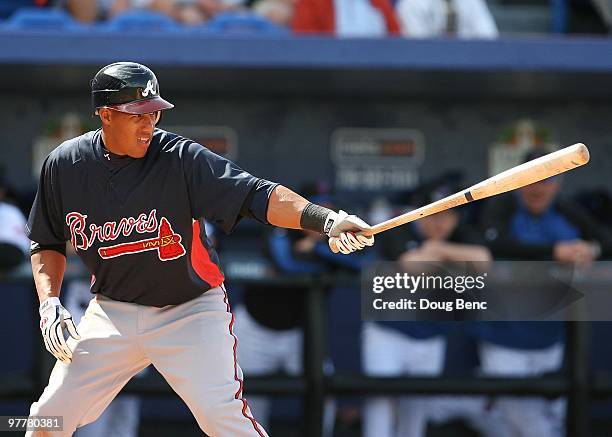 Yunel Escobar of the Atlanta Braves bats against the New York Mets at Tradition Field on March 2, 2010 in Port St. Lucie, Florida.