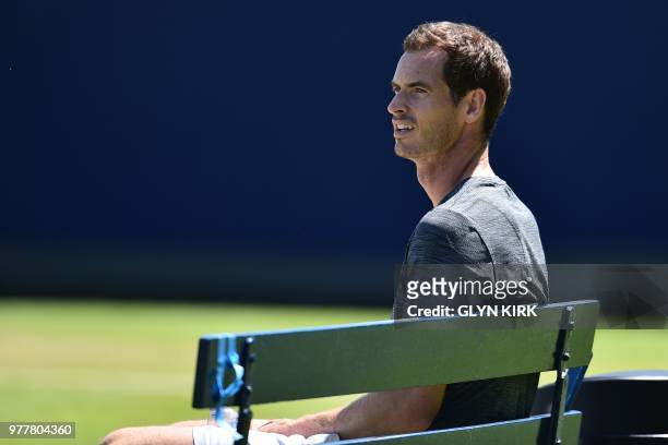 Britain's Andy Murray takes a break during practice, ahead of his first round match at the ATP Queen's Club Championships tennis tournament in west...