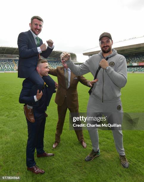 Boxer Carl Frampton gives friend and fellow boxer Paddy Barnes a leg up as he goes toe to toe with Tyson Fury watched by promoter Frank Warren as...