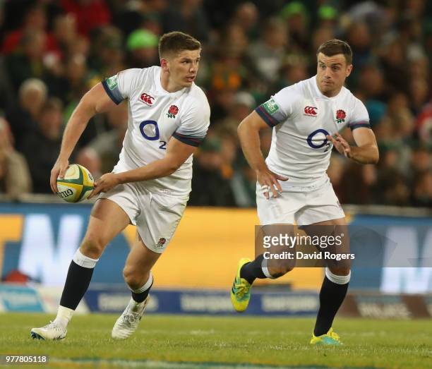 Owen Farrell breaks with the ball as George Ford adds support during the second test match between South Africa and England at Toyota Stadium on June...