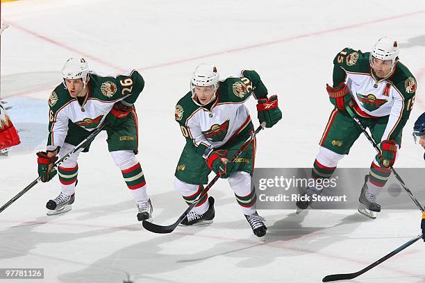 Jaimie Sifers, Antti Miettinen and Andrew Brunette of the Minnesota Wild skates against the Buffalo Sabres at HSBC Arena on March 12, 2010 in...