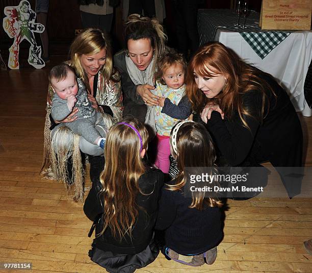 Kate Moss, Flynn Tilbury, Bay Garnett and Charlotte Tilbury attend the launch for Stella McCartney's collection for GAP at the Porchester Hall on...