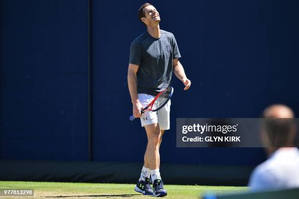 Britain's Andy Murray gestures during practice, ahead of his first round match at the ATP Queen's Club Championships tennis tournament in west London...