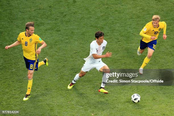 Jung Seung-Hyun of South Korea battles with Albin Ekdal of Sweden and Emil Forsberg of Sweden during the 2018 FIFA World Cup Russia Group F match...