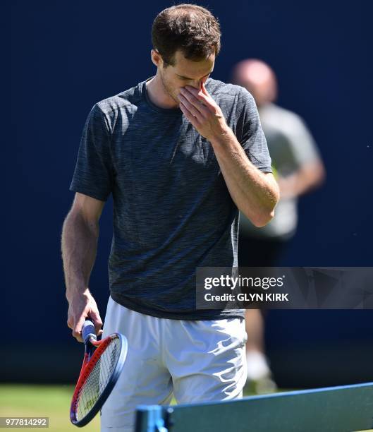 Britain's Andy Murray gestures during practice, ahead of his first round match at the ATP Queen's Club Championships tennis tournament in west London...