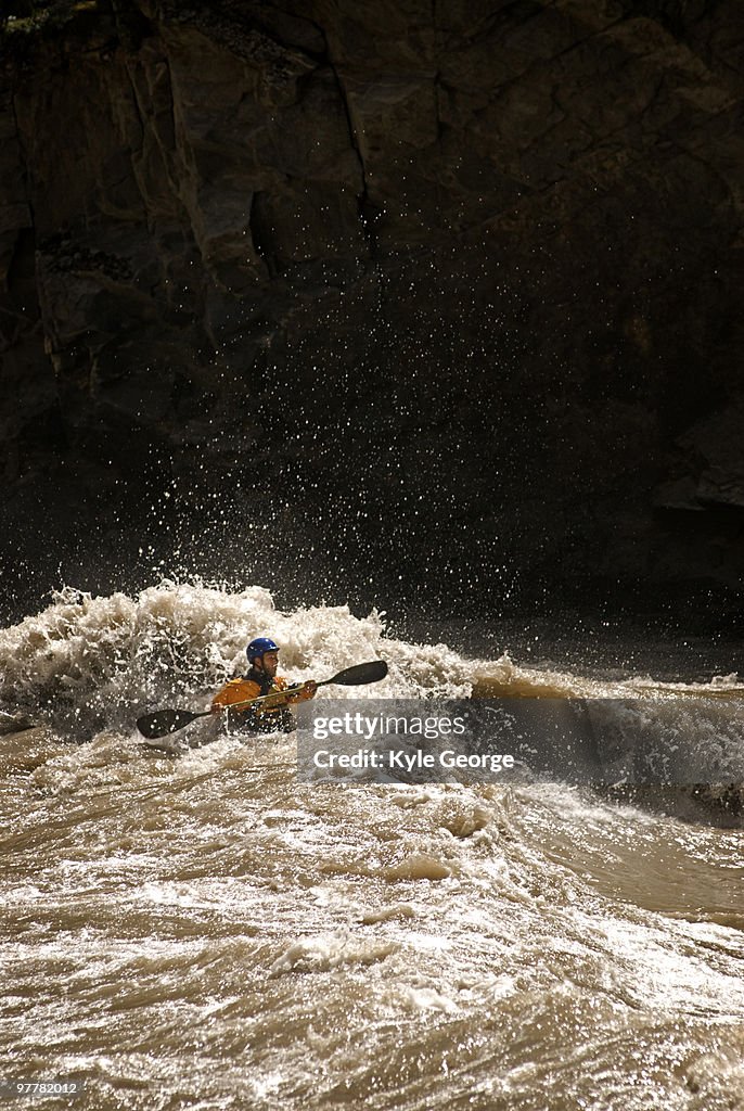 A kayaker encounters big whitewater during a rafting trip in Western China.