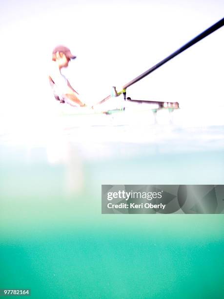 a young man rows a scull on lake tahoe in incline village, nevada. - single scull bildbanksfoton och bilder