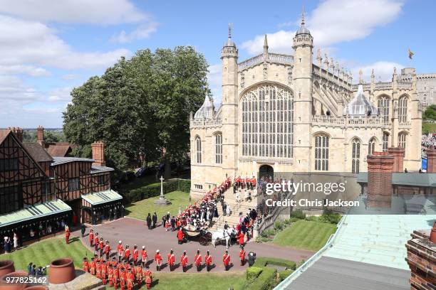 The Knights of the Garter, guards, military, other members of the Royal family surround the steps during the Order of The Garter Service at Windsor...