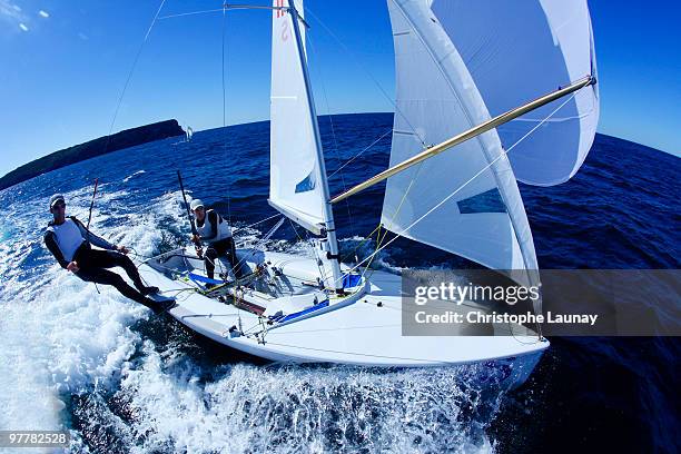 two male athletes sail an olympic class racing boat in sydney harbor, australia. - fish eye lens stock pictures, royalty-free photos & images