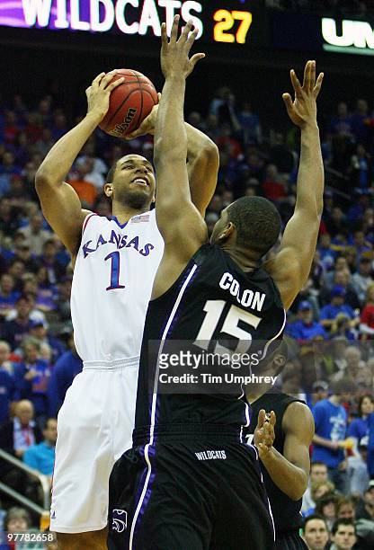 Xavier Henry of the Kansas Jayhawks shoots over Luis Colon of the Kansas State Wildcats during the 2010 Phillips 66 Big 12 Men's Basketball...
