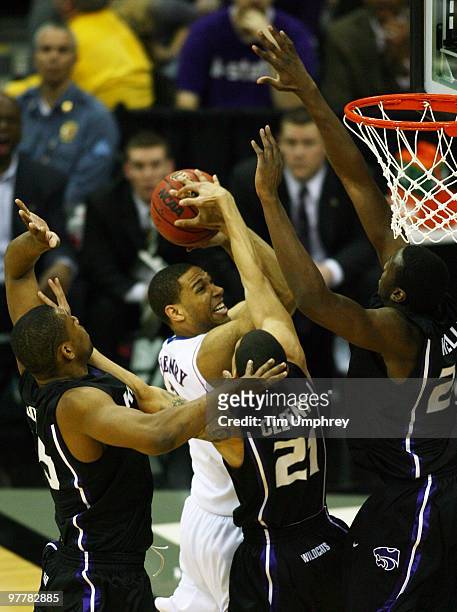 Xavier Henry of the Kansas Jayhawks goes up for a shot while defended by multiple Kansas State Wildcats in the 2010 Phillips 66 Big 12 Men's...