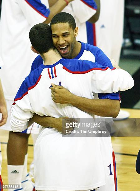 Xavier Henry and Tyrel Reed of the Kansas Jayhawks embrace before taking on the Kansas State Wildcats in the 2010 Phillips 66 Big 12 Men's Basketball...