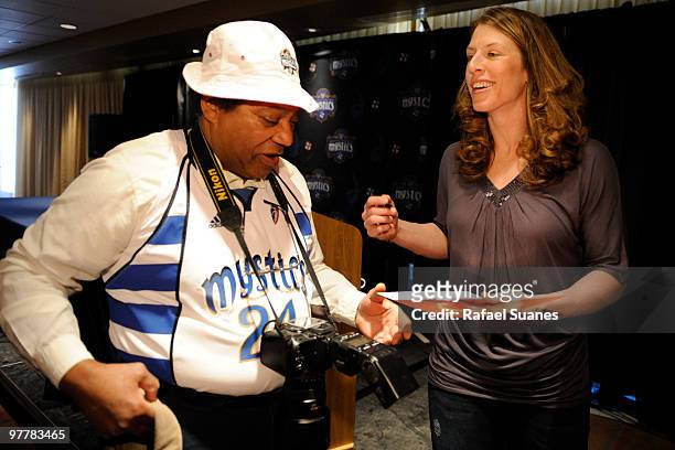 New Washington Mystic Katie Smith signs a autograph for a fan after a press conference to announce the signing of the free agent at Verizon Center on...