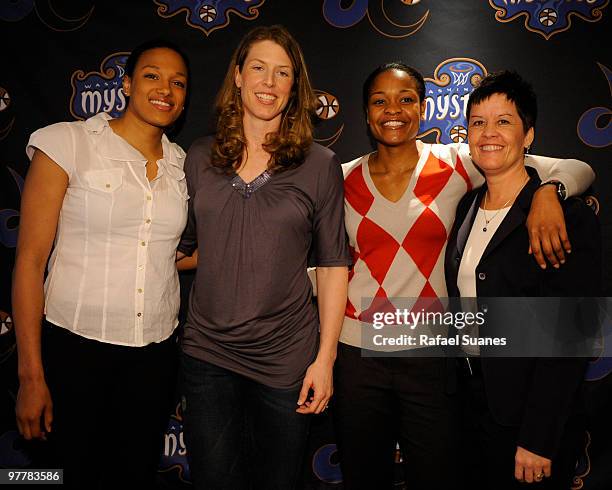 Washington Mystics Marissa Coleman, Katie Smith, Alana Beard and head coach Julie Plank pose for a photo op after a press conference to announce the...