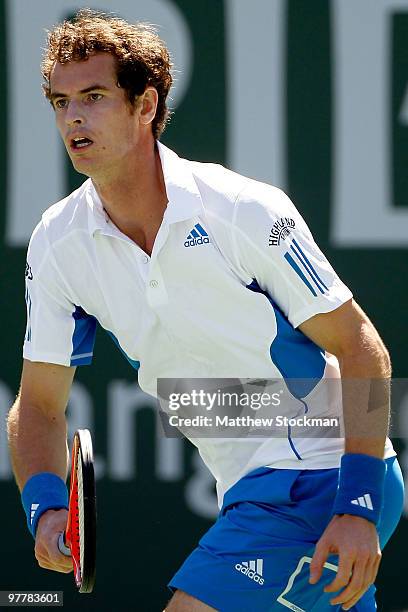 Andy Murray of Great Britain chases down a ball while playing Michael Russell during the BNP Paribas Open on March 16, 2010 at the Indian Wells...