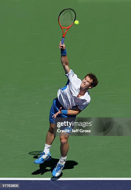 Andy Murray of Great Britain hits a serve to Michael Russell during the BNP Paribas Open at the Indian Wells Tennis Garden on March 16, 2010 in...