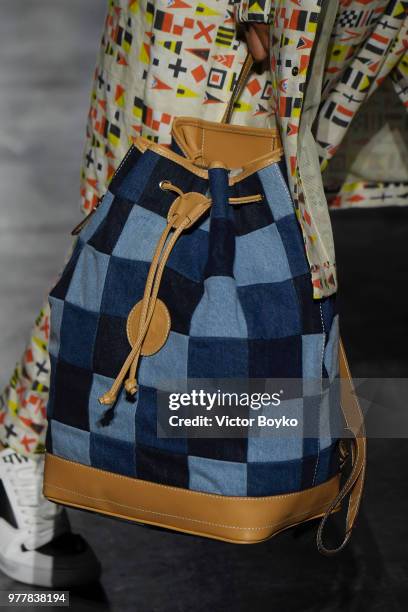 Model, bag detail, walks the runway at the Hunting World show during Milan Men's Fashion Week Spring/Summer 2019 on June 18, 2018 in Milan, Italy.