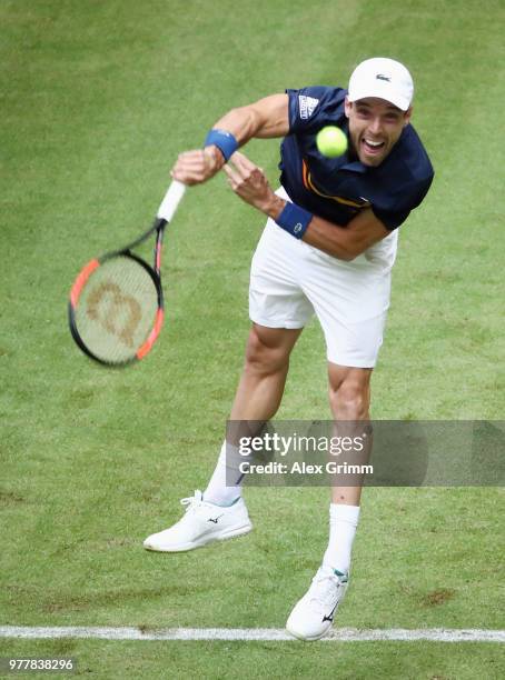 Roberto Bautista Agut of Spain serves the ball to Jan Lennard Struff of Germany during their first round match on day 1 of the Gerry Weber Open at...