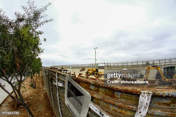 June 2018, Mexico, Tijuana: Construction machines working along the border between San Diego and Tijuana. A 14-mile long stretch of the border fence...