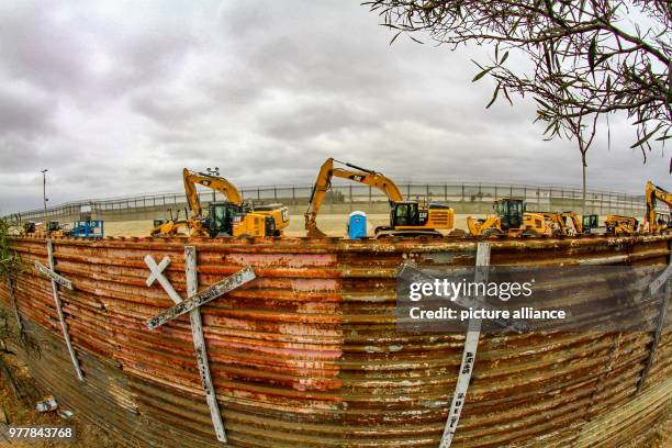 June 2018, Mexico, Tijuana: Construction machines working along the border between San Diego and Tijuana. A 14-mile long stretch of the border fence...