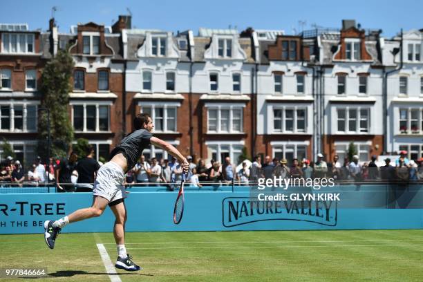 Britain's Andy Murray serves during practice, ahead of his first round match at the ATP Queen's Club Championships tennis tournament in west London...