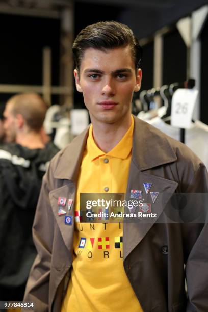 Model is seen backstage ahead of the Hunting World show during Milan Men's Fashion Week Spring/Summer 2019 on June 18, 2018 in Milan, Italy.