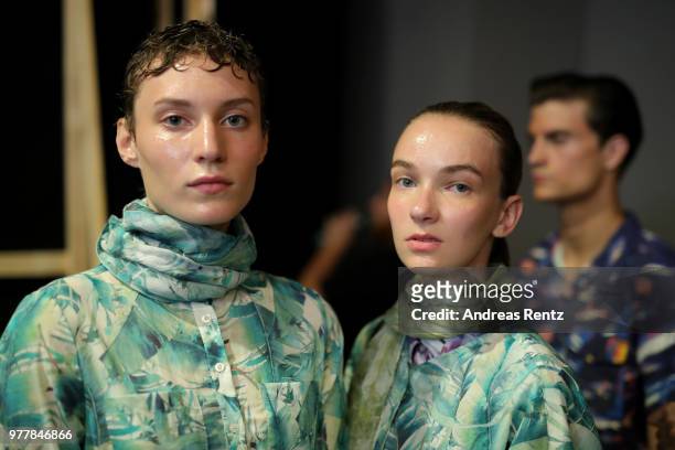 Models are seen backstage ahead of the Hunting World show during Milan Men's Fashion Week Spring/Summer 2019 on June 18, 2018 in Milan, Italy.