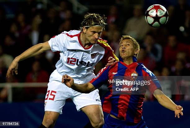 Sevilla's Marius Stankevicius vies with CSKA MoscowÂ's Japanesse midfielder Keisuke Honda during their UEFA Champions League football match on March...