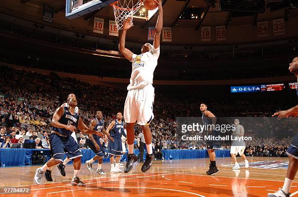 Kevin Jones of the West Virginia Mountaineers takes a shot during the Big East Final College Basketball Tounament game against the Georgetown Hoyas...