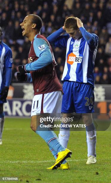 Aston Villa's English forward Gabriel Agbonlahor celebrates after Wigan Athletic's Irish midfielder James McCarthy scored an own goal during the...