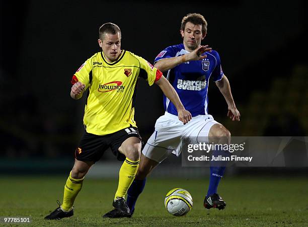 Heidar Helguson of Watford battles with Gareth McAuley of Ipswich during the Coca-Cola Championship match between Watford and Ipswich at Vicarage...