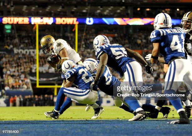 Pierre Thomas of the New Orleans Saints gets stopped at the goal line on 4th down by the defense of the Indianapolis Colts in Super Bowl XLIV on...
