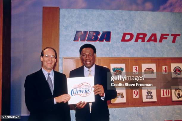 Deputy Commissioner Russ Granik and Elgin Baylor, general manager of the LA Clippers, pose for a photo during the 1998 NBA Draft on June 24, 1998 at...