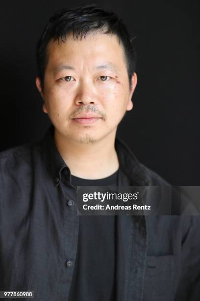 Designer Yosuke Aizawa poses backstage ahead of the Hunting World show during Milan Men's Fashion Week Spring/Summer 2019 on June 18, 2018 in Milan,...