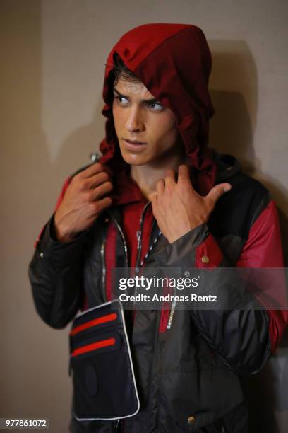 Model is seen backstage ahead of the Hunting World show during Milan Men's Fashion Week Spring/Summer 2019 on June 18, 2018 in Milan, Italy.