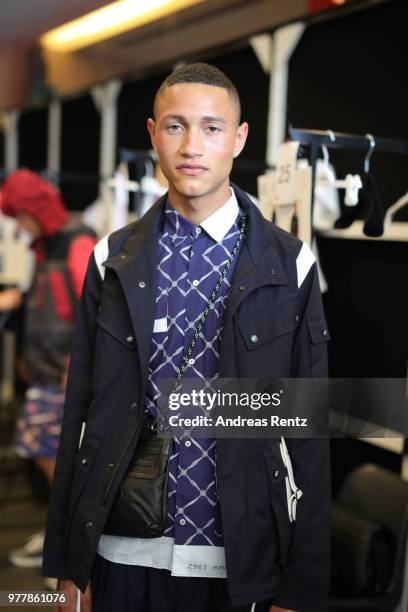 Model is seen backstage ahead of the Hunting World show during Milan Men's Fashion Week Spring/Summer 2019 on June 18, 2018 in Milan, Italy.