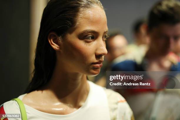 Model is seen backstage ahead of the Hunting World show during Milan Men's Fashion Week Spring/Summer 2019 on June 18, 2018 in Milan, Italy.