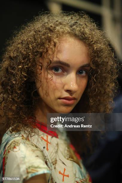 Model is seen backstage ahead of the Hunting World show during Milan Men's Fashion Week Spring/Summer 2019 on June 18, 2018 in Milan, Italy.