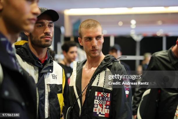 Models are seen backstage ahead of the Hunting World show during Milan Men's Fashion Week Spring/Summer 2019 on June 18, 2018 in Milan, Italy.