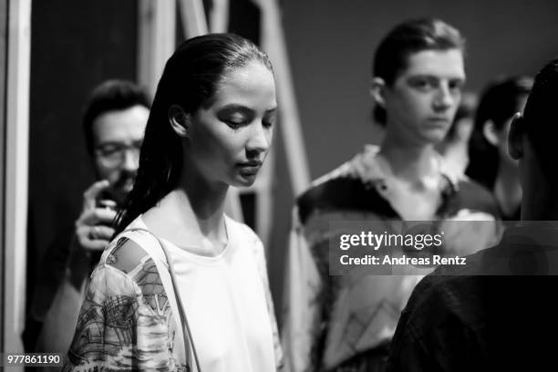 Models are seen backstage ahead of the Hunting World show during Milan Men's Fashion Week Spring/Summer 2019 on June 18, 2018 in Milan, Italy.