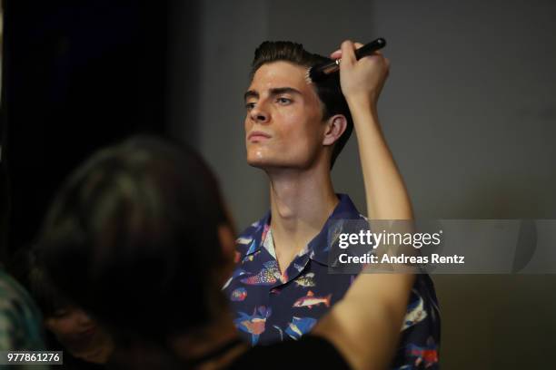 Model seen backstage ahead of the Hunting World show during Milan Men's Fashion Week Spring/Summer 2019 on June 18, 2018 in Milan, Italy.