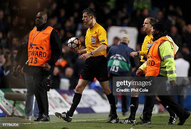 Referee Wolfgang Stark leaves the field at half time during the UEFA Champions League Round of 16 second leg match between Chelsea and Inter Milan at...