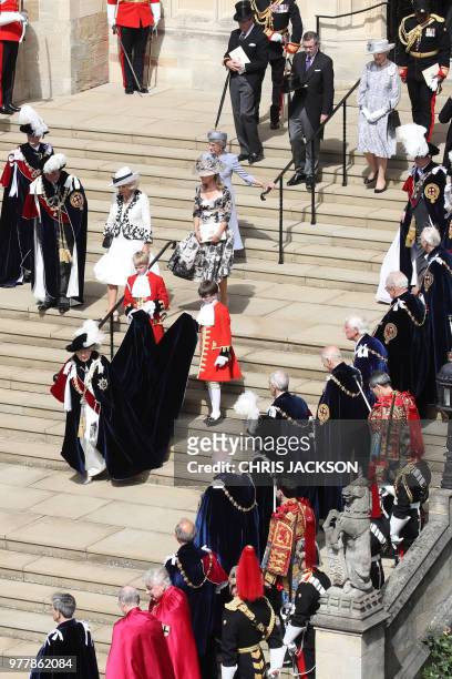 Britain's Queen Elizabeth II descends the west steps after the Most Noble Order of the Garter Ceremony at St George's Chapel, Windsor Castle in...