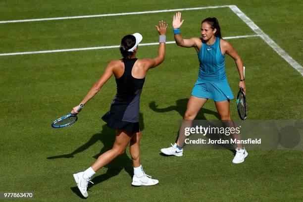 Garbine Muguruza of Spain and Daria Kasatkina of Russia clap hands during their double match against Andrea Sestini Hlavackova of the Czech Republic...