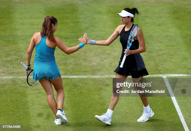 Garbine Muguruza of Spain and Daria Kasatkina of Russia clap hands during their double match against Andrea Sestini Hlavackova of the Czech Republic...