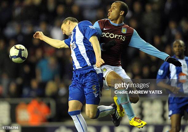Aston Villa's English forward Gabriel Agbonlahor vies with Wigan Athletic's Scottish defender Gary Caldwell during the English Premier league...