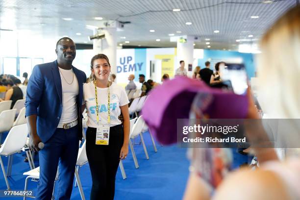 Akon poses with a fan during the GABBCON session at the Cannes Lions Festival 2018 on June 18, 2018 in Cannes, France.